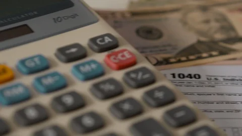Income Tax Return Refund Forms 1040 On White Desk Movement Stock-Footage 87196657