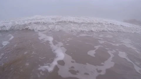 Incoming beach wave with mountains in the background Vídeo Stock 159350864