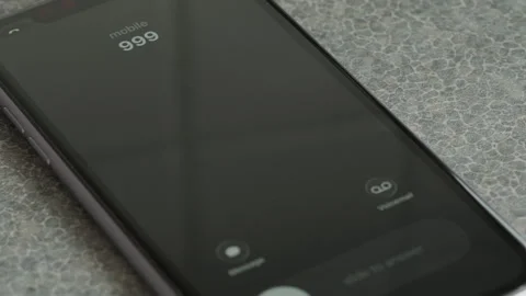 Incoming call from 999 on smartphone macro video. 스톡 동영상 340531935