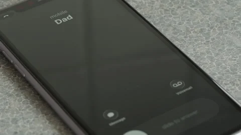 Incoming call from Dad on smartphone macro video. Stock Footage 340532180