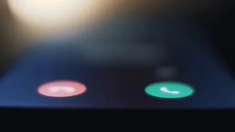 Incoming call on smartphone ringing, macro shallow depth of field pan shot Stock Footage 125335038