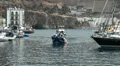 Incoming fisherman boat at harbor Puerto de Mogan HD Footage