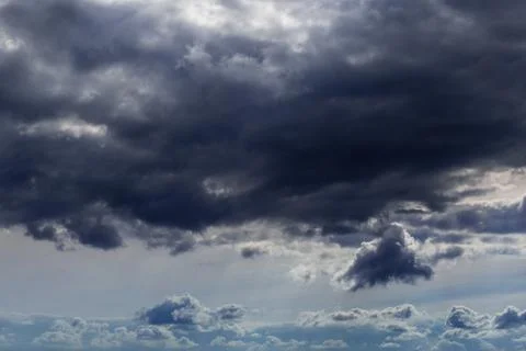 Incoming storm close-up cloudscape at march daylight in continental europe Stockfoto's
