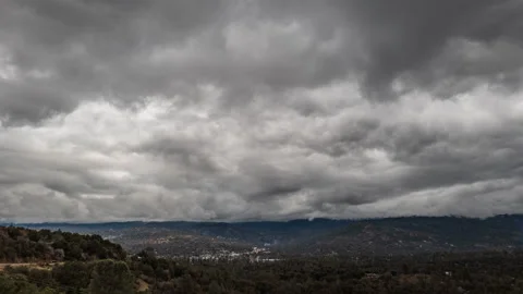 Incoming Storm Clouds above Quaint Mountain Town with Busy Highway Stock Footage 285692893