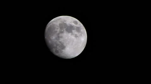 Incomplete silvery moon Stock Footage 99394281