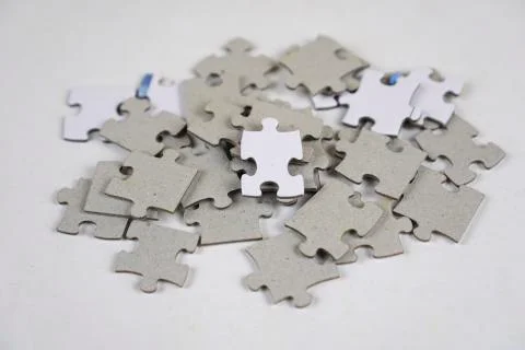 Incomplete stack Jigsaw puzzle pieces background concept copy space Stock Photos
