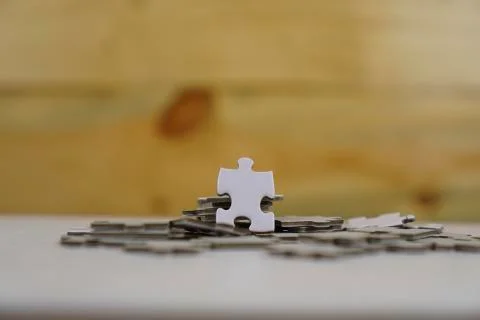 Incomplete stack Jigsaw puzzle pieces background concept copy space. Wooden r Stock Photos