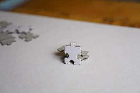 Incomplete stack Jigsaw puzzle pieces background concept copy space. Wooden r Foto stock