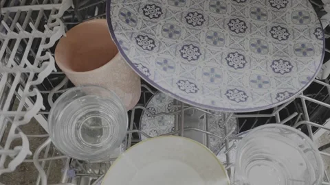 Incorrectly Loaded Dishwasher with Trapped Water in Cups and Glasses Stock Footage 334780859