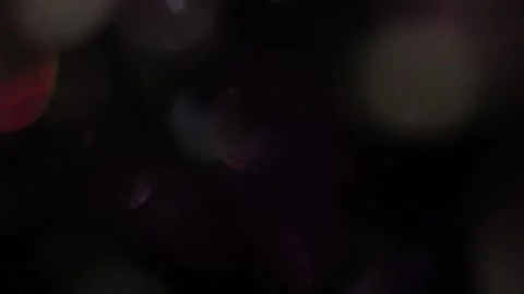 The increase and decrease of bokeh lights in the dark Stock Footage 317449842