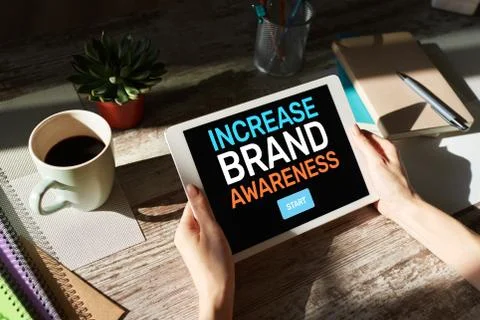 Increase brand awareness text on screen. Advertising and marketing concept. Фото