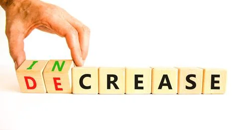 Increase or decrease symbol. Concept words Increase and Decrease on wooden cu 스톡 사진