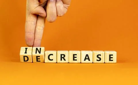 Increase or decrease symbol. Concept words Increase and Decrease on wooden .. 库存照片