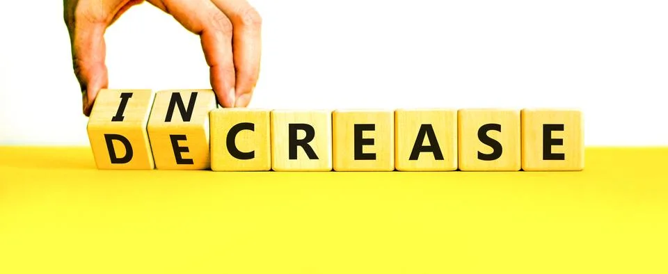 Increase or decrease symbol. Concept words Increase and Decrease on wooden .. 스톡 사진