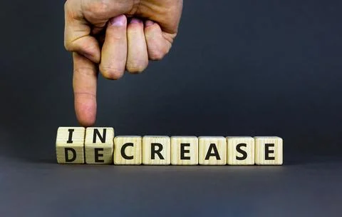 Increase or decrease symbol. Concept words Increase and Decrease on wooden .. Stock Photos