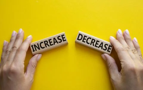 Increase or Decrease symbol. Concept word Increase or Decrease on wooden bloc Stock Photos