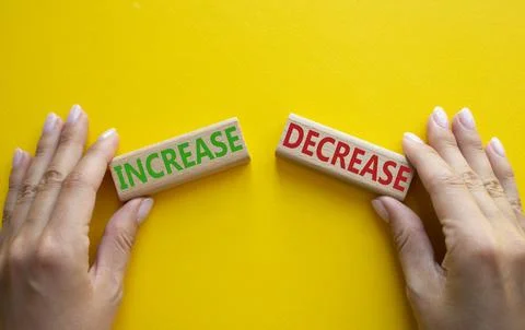 Increase or Decrease symbol. Concept word Increase or Decrease on wooden bl.. 库存照片