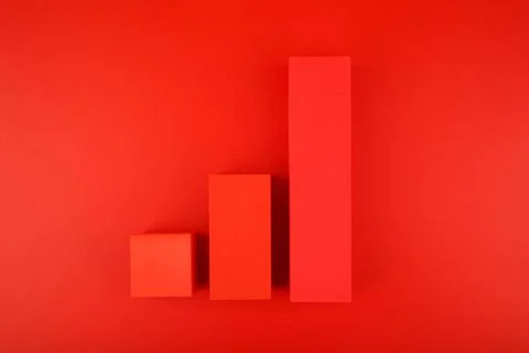Increasing chart made of red blocks on red background Stock Photos