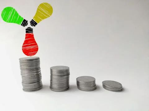 Increasing coin stack with bulbs idea and imagination concept Stock Photos