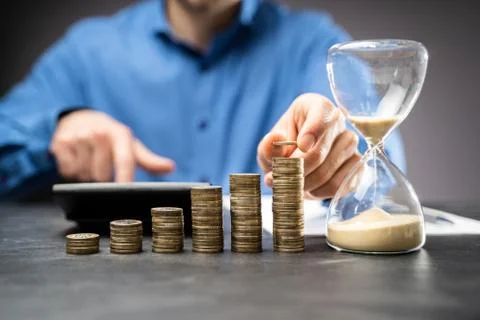 Increasing Money Coin Stack Concept. Hourglass Stock Photos