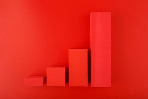 Increasing performance chart made of red blocks on red background Stock Photos