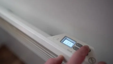 Increasing temperature on electric radiator Stock Footage 232530017