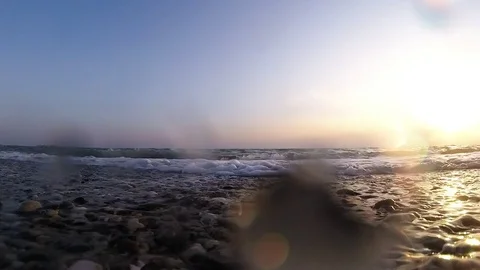 The increasing wave of the sea at sunset in summer Stock Footage 84201222