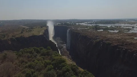 Incredible aerial view above the Devils Pool at Victoria Falls, revealing Stock Footage 97387998