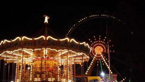 Incredible attraction roller coaster in funfair amusement park in flashing Stock Footage 97295026