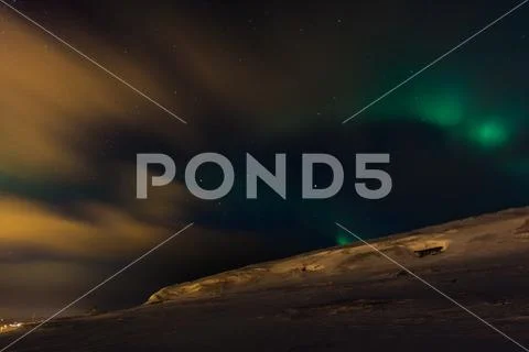 Incredible aurora borealis activity above ekkeroy island Stock Photos