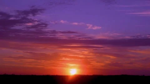 Incredible bright colorful dawn sky shining sun with rays and beams sunlight hor Vídeo Stock 329180053