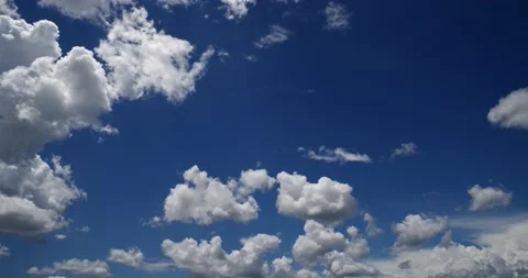 Incredible deep blue sky, sparse multiple clouds moving in different directions Stock Footage 152525552