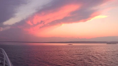 Incredible deep colored sunset from boat  Video stock 81472809