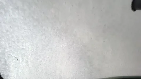 Incredible demonstration of an automatic robot car wash in action during a sunny Stock Footage 317021375