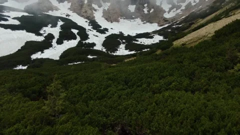 Incredible drone shot of the rocks in clouds. Camera backward. Ukrainian Carp Stock Footage 168525090