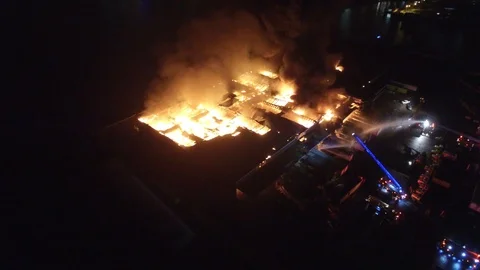 Incredible drone shot of structure fire in Toronto, Canada consuming plant Stock Footage 92644163