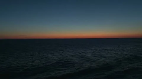 The incredible gradiant glow of a sunset while at sea Stock Footage 11194657