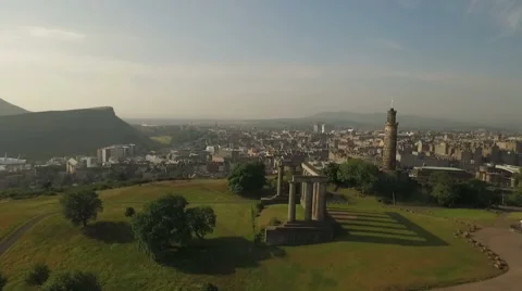 Incredible shot of Calton hill, revealing the skyline of Edinburgh, Scotland Stock Footage