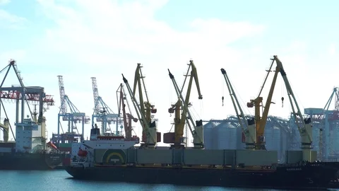 Incredible steady view on huge container ship cargo freight vessel unloaded by Stock Footage 98408310