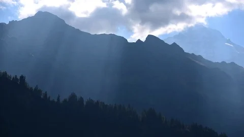 Incredible Timelapse of Sunrays Shining Through the Clouds at the Jungfrau Stock Footage 80605336