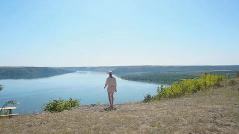 Incredible view of the canyon with the river behind the girl. Freedom concept Stock Footage 255459543