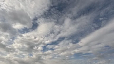 Incredibly beautiful cumulus textured clouds slowly moves under blue sky Stock Footage 318097756