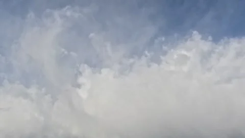 Incredibly beautiful cumulus textured clouds slowly moves under blue sky Stock Footage 318098152