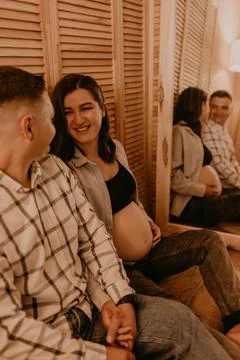 An incredibly beautiful married couple Expecting child, pregnant wife. Stock Photos