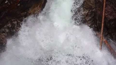 Incredibly beautiful powerful waterfall in the mountains Stock Footage 154414944