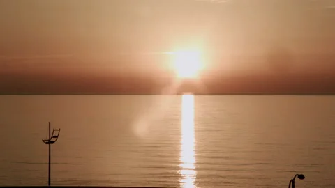 Incredibly beautiful sunset on the coast. time lapse Stock Footage 133801296