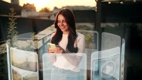 An Incredibly Beautiful Woman is Using an Augmented Reality Phone to Browse Web Stock Footage 283672499