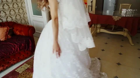 Incredibly beautiful, young bride posing in a hotel room Stock Footage 58165297