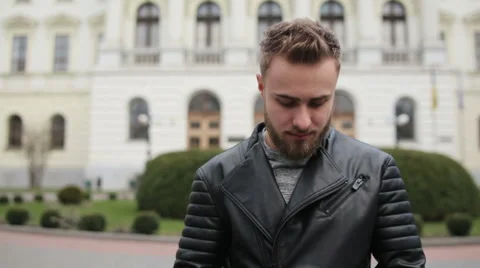 Incredibly cute young man looking directly on a camera Stock Footage 63468766
