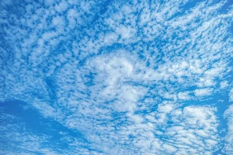 .incredibly deep sky with white clouds in the rays of the sun Stock Photos